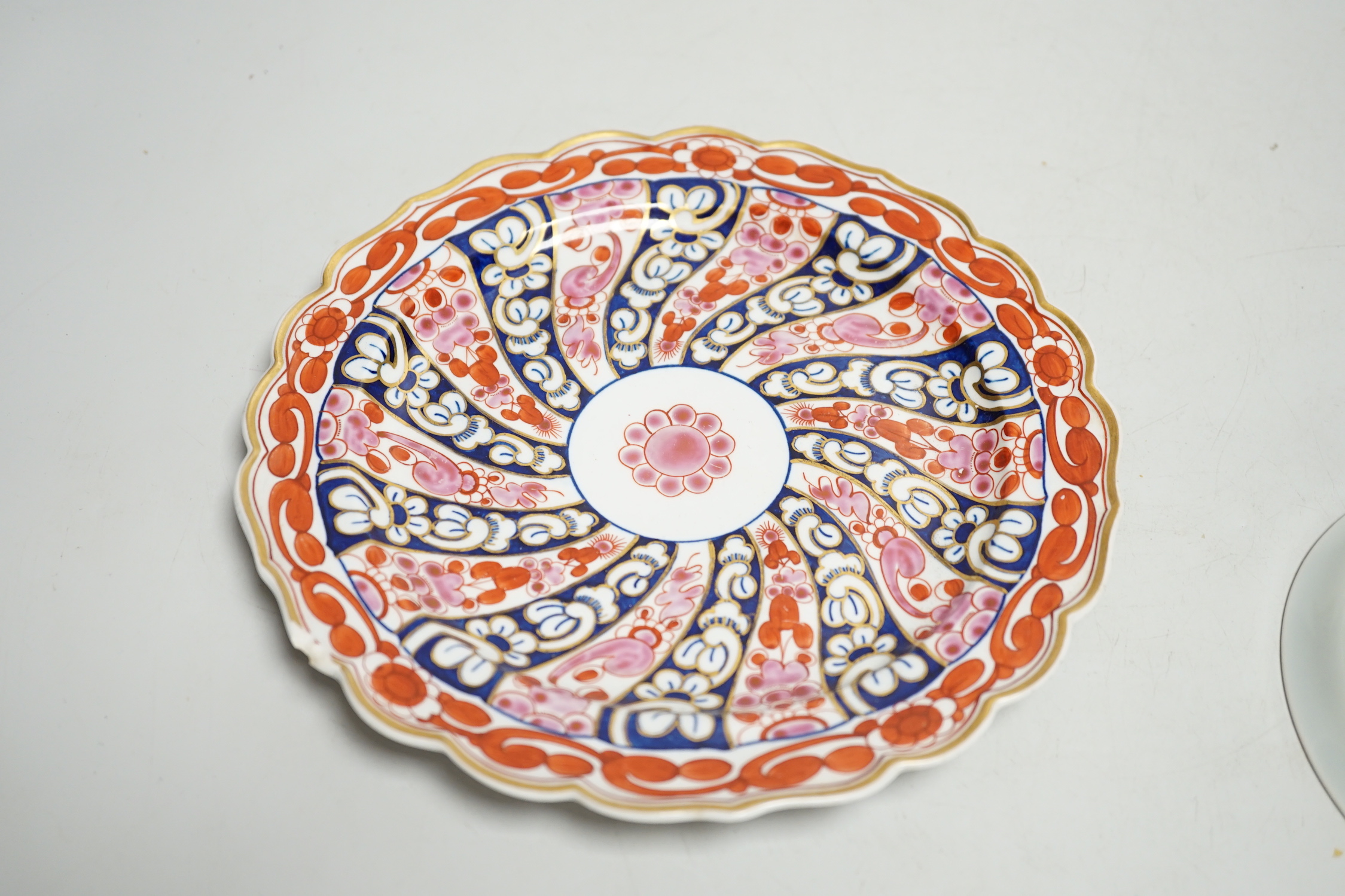 A Worcester kakiemon style scale blue trio, c.1770, a Worcester Queen Charlotte’s pattern plate, 19.5 cm and a Samson saucer in Worcester style